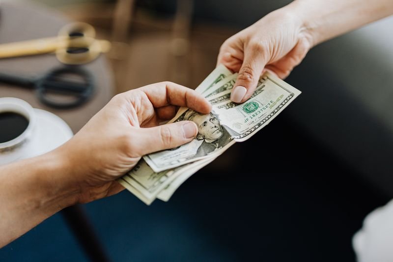 A private lender and borrower reviewing a loan