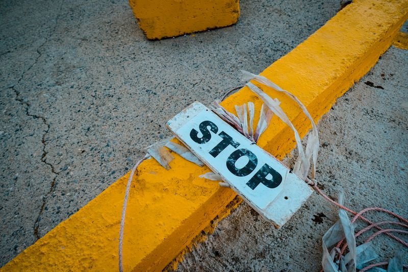 A caution sign warning against a risky financing decision