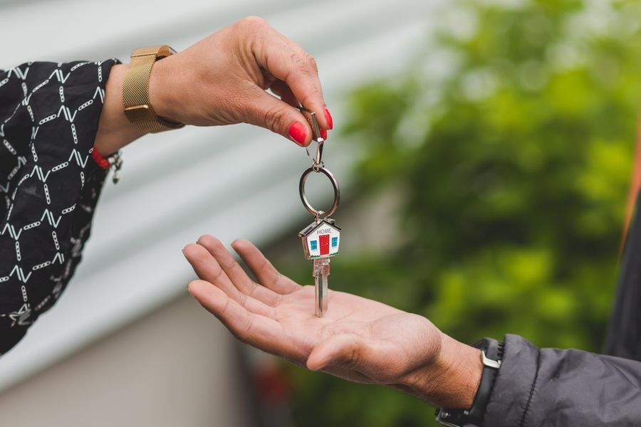 Property manager handing over house keys