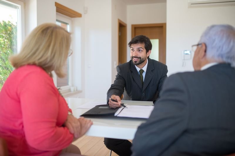 Stockbroker meeting a client in an office