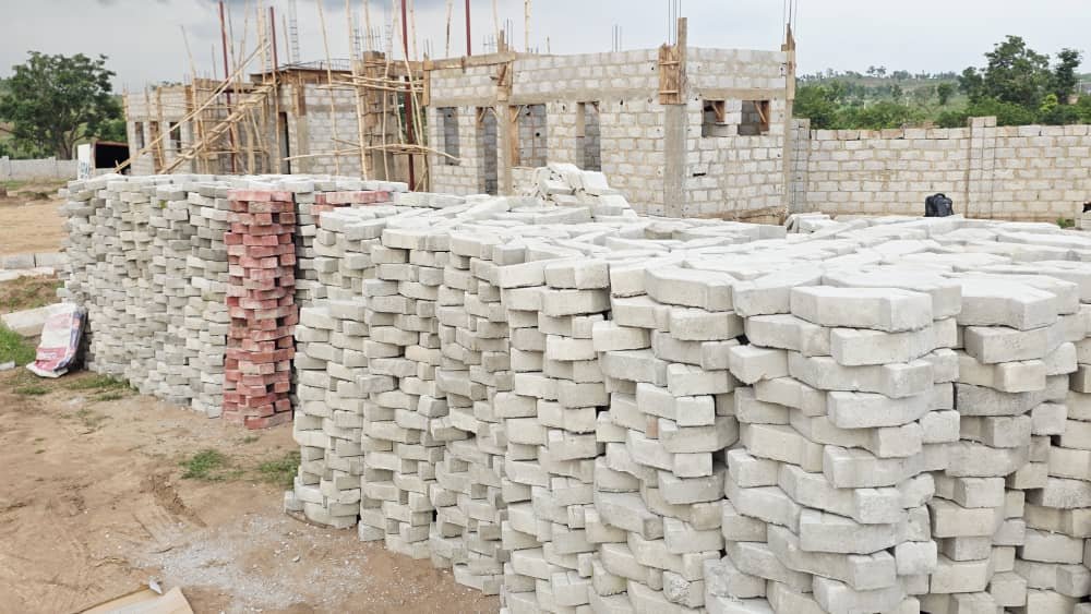 Interlocking pavers and buildings under construction at Solar City, Apo
