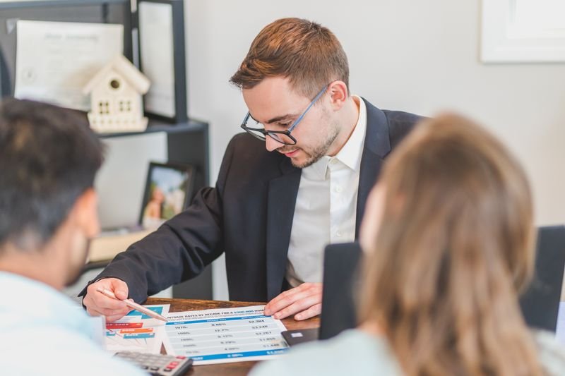 Agent explaining a rent to own payment plan to a client